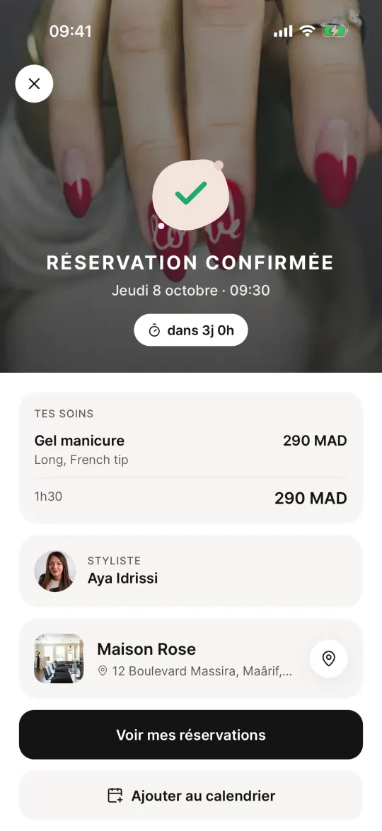 La réservation est confirmée, avec le salon, la styliste et le prix